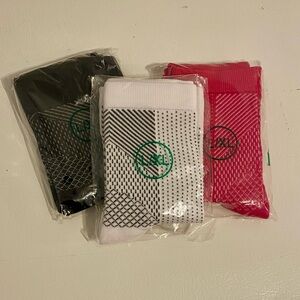 Set of Three Patterned Socks - Black, White, and Pink.